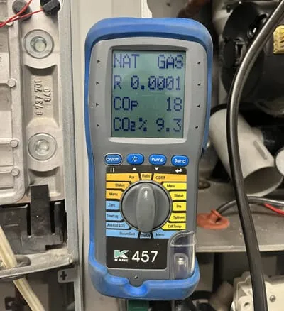 Kane 457 flue gas analyser showing a natural gas combustion reading