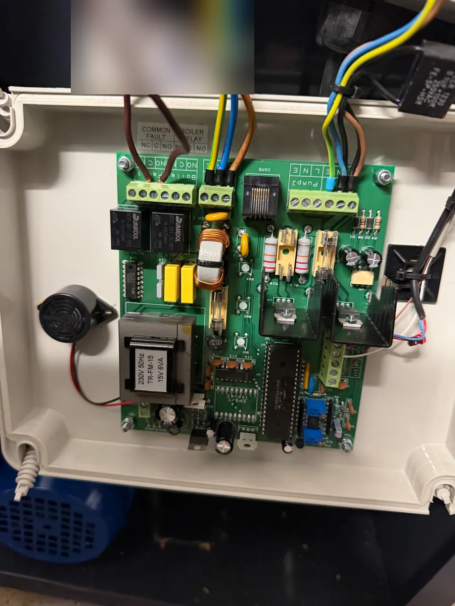 Opened control panel for pumps and boiler fault relay in a plant room, Lancaster