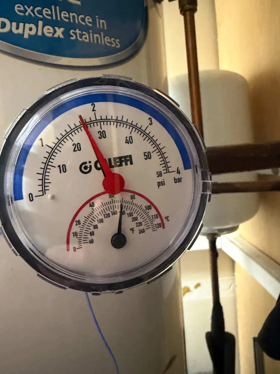 Combined pressure and temperature gauge on a hot water cylinder, Preston