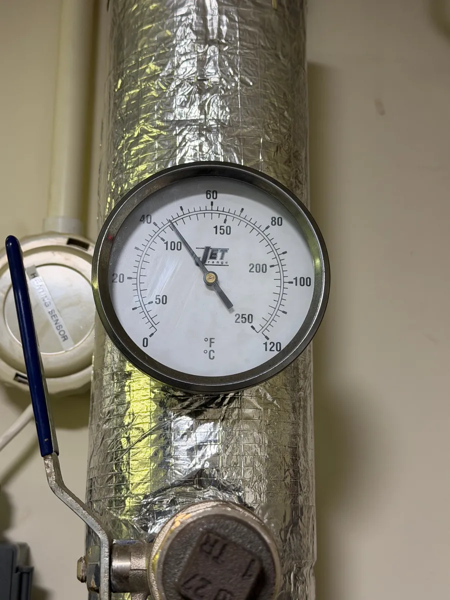 Temperature gauge on an insulated heating pipe, Walton Summit, Preston